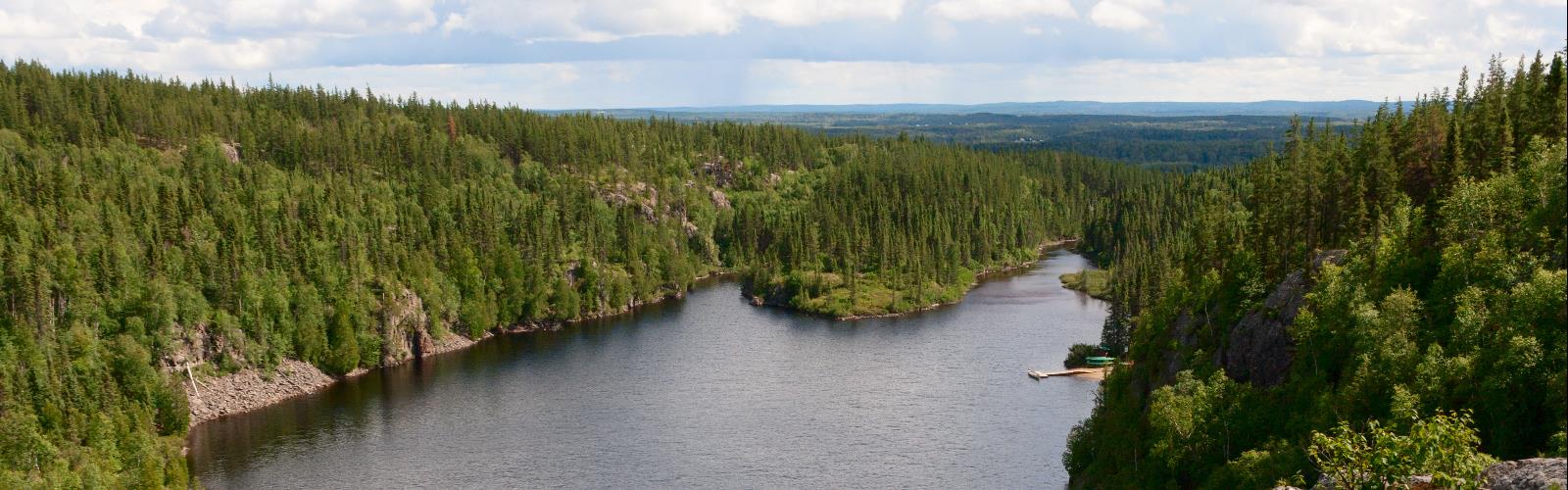 water tree sky outdoor river nature mountain plant lake surrounded traveling forest hillside land island