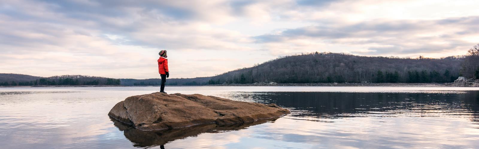 sky water outdoor cloud landscape nature mountain tree rock lake reflection shore day person