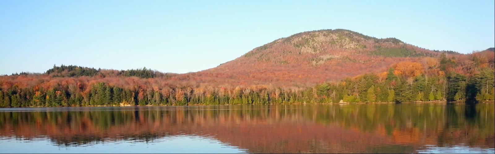 water sky tree outdoor lake nature river autumn landscape mountain pond plant surrounded reflection fall several