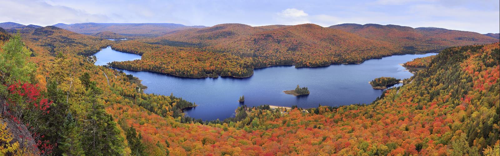 water sky outdoor mountain tree river lake autumn grass fall nature landscape hillside overlooking plant surrounded cloud hill beautiful pond traveling lush island land wooded distance