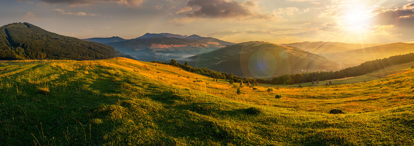 grass sky outdoor mountain field landscape cloud nature grassy green hill background lush sun sunrise pasture open sunset hillside cloudy clouds distance overlooking highland day land