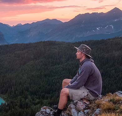 mountain outdoor sky hiking person clothing man nature cloud tree canyon highland soil