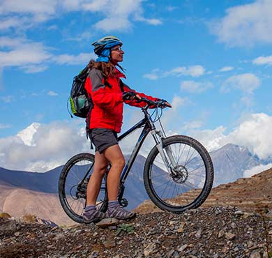 outdoor sky ground bicycle wheel sports equipment man bike bicycle helmet wheel land vehicle mountain vehicle transport bicycle rocky bicycles--equipment and supplies cycle sport cycling dirt backpack Luggage and bags person cycle Land vehicle Vehicle