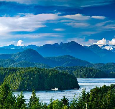 British Columbia  water mountain tree lake sky outdoor landscape nature cloud river background surrounded beautiful overlooking clouds distance land hillside highland