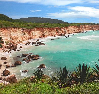 Dominican Republic  sky outdoor beach mountain water nature ocean landscape coastal and oceanic landforms cliff cloud lake coast bight body of water sandy island land