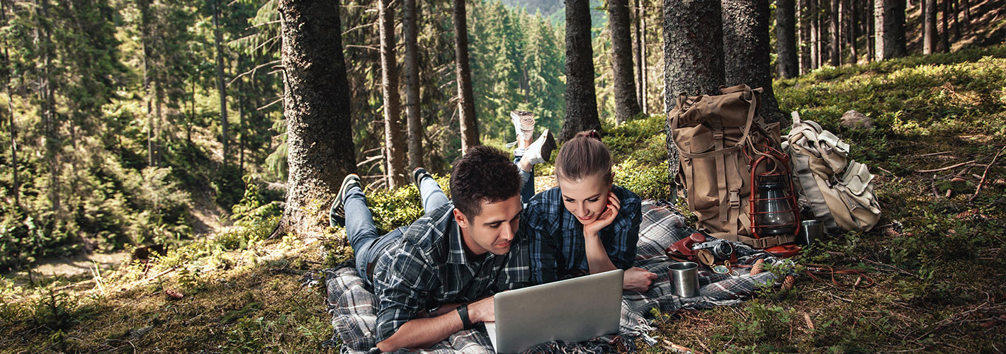 tree outdoor person laptop clothing computer man working plant Luggage and bags Laptop