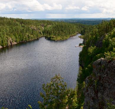 Abitibi-Témiscamingue  water tree sky outdoor river nature mountain plant lake surrounded traveling forest hillside land island