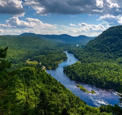 Quebec City, National Capital  mountain outdoor sky tree nature water cloud landscape green background hillside hill lake beautiful lush surrounded overlooking pasture distance day highland plant field land