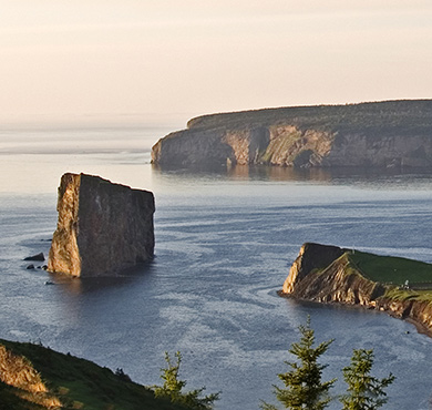 Gaspésie - Îles-de-la-Madeleine  sky water lake beach outdoor mountain nature landscape cloud shore promontory lush hillside